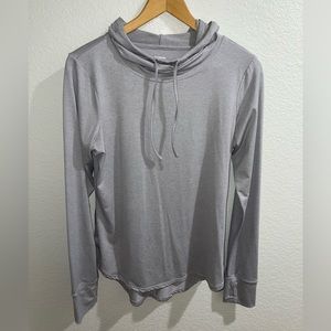 Reebok active top, long sleeves, thumb hole for running. Back is longer.